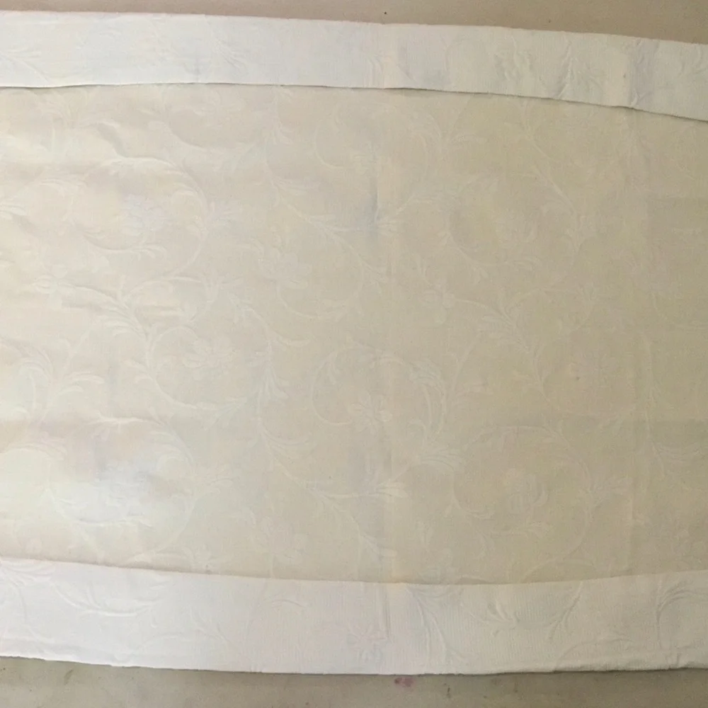 Headboard slipcover. Matelasse fabric in ecru.